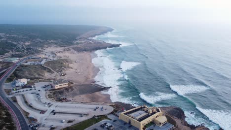Flying-over-the-Portuguese-Coastline-by-the-Atlantic-Coast,-nearby-Guincho-Beach-in-Portugal