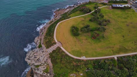 Top-View-Of-Tourists-At-Marks-Park-And-Rocky-Coastline-Of-Mackenzies-Bay-In-Australia