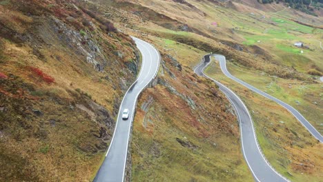 A-car-on-Furka-pass-road-in-Switzerland-in-autumn