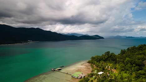 4K-Timelapse-of-Boat-Travelling-Through-Channel-Between-Islands-on-Koh-Chang,-Thailand-with-Stormy-Clouds-Overhead