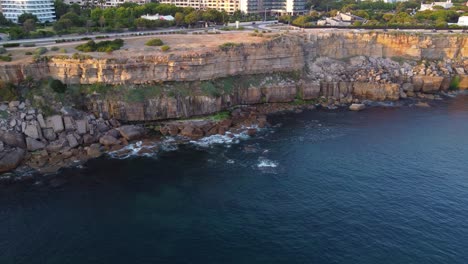 AERIAL-Panning-Shot-of-a-Rocky-Cascais-Coastline-in-Portugal