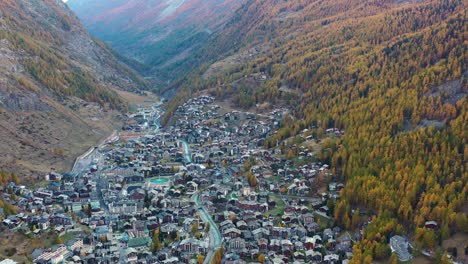 Aerial-view-of-Zermatt,-town-under-famous-mountain-Matterhorn,-turn-of-autumn-and-winter---landscapes-of-Swiss-Alps-from-above,-Switzerland,-Europe