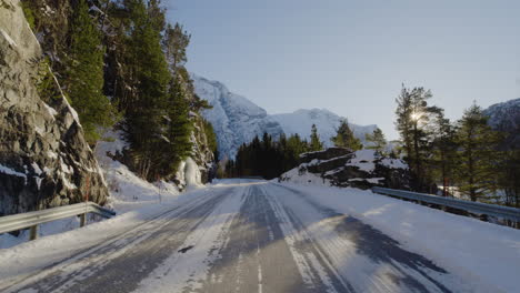Driving-At-Mountain-Road-Tunnel-Reveal-Scenic-Winter-Landscape-On-A-Sunny-Day-In-Norway