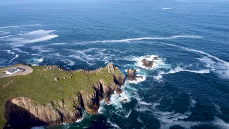 4K-Drone-footage-of-Lands-End-cliffs-with-a-small-island-and-waves-and-deep-blue-sea