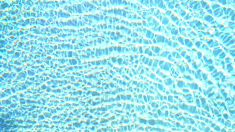 The-water-in-a-swimming-pool-shimmers-in-the-sunlight