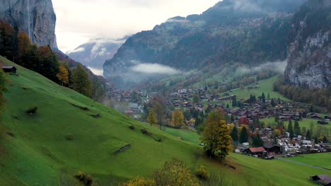 Lauterbrunnen-in-Switzerland-with-its-famous-waterfall-in-autumn---drone-footage