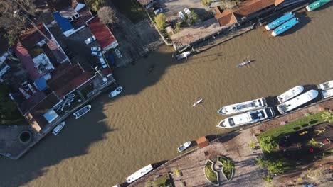 Aerial-top-down-shot-of-two-kayak-boats-rowing-on-river-in-Tigre-City