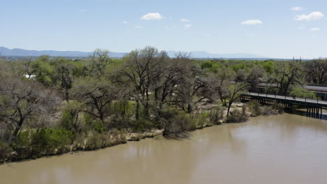 Rio-Grande-River-with-Highway-Road-Bridge-in-Albuquerque,-New-Mexico---Aerial