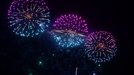 Colorful-Fireworks-at-Night-Sky,-New-Year-or-National-Holiday-Celebration,-Full-Frame
