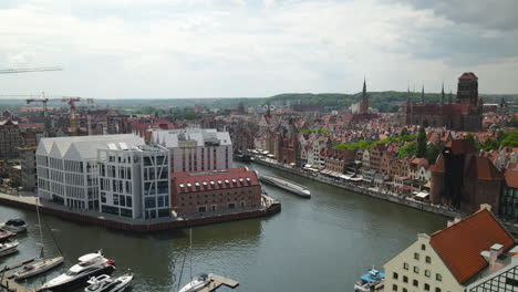 Flying-over-stunning-Marina-Gdansk-in-Old-Town,-Basilica-of-St