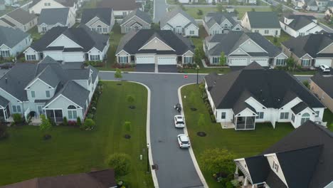 Reverse-aerial-above-suburban-residential-community-in-USA