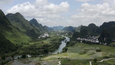 Aerial:-Li-River-flowing-through-beautiful-karst-mountain-landscape-in-China