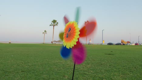 close-up-shot-for-Rainbow-Color-Windmill-Toys-for-Kids-Toy-in-Beach