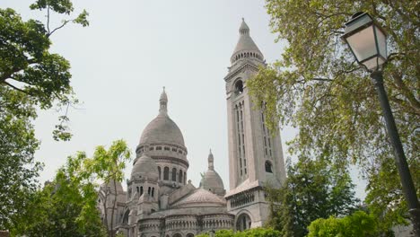 Dome-And-Bell-Tower-Of-The-Famous-Sacre-Coeur-Basilica-As-Seen-From-Montmartre-In-Paris,-France-On-A-Sunny-Day