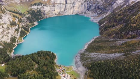 Aerial-view-of-Turquoise-glacier-lake-Oeschinensee