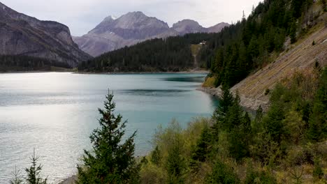 Aerial-view-of-Mountains-and-fall-forest-at-Turquoise-glacier-lake-Oeschinensee