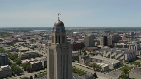 Drone-Flies-Away-from-Nebraska-Statehouse-Located-in-Downtown-Lincoln