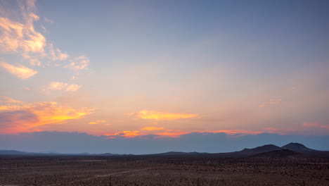 The-vast-expanse-of-the-Mojave-Desert-at-sunset---aerial-hyper-lapse