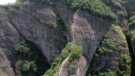 Aerial:-amazing-hike-up-Bajiao-Shan-mountain,-Chinese-mountain-steps-hike