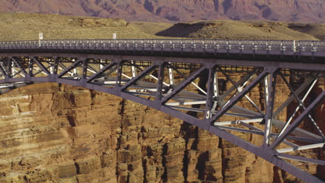 Panoramic-shot-of-expansive-Navajo-bridge-structure-over-Marble-Canyon,-Arizona