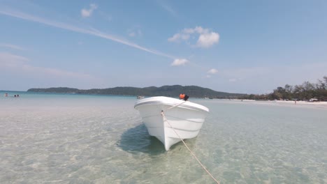 Small-white-motor-boat-sitting-in-the-tropical-bay-of-Koh-Rong-Samloem-in-Cambodia