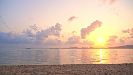 Panoramic-View-of-a-Tropical-Sunset-Above-Empty-Island-Beach,-Peninsula-and-Calm-Sea-With-Stunning-Cloudy-Horizon