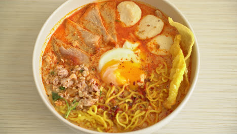 egg-noodles-with-pork-and-meatball-in-spicy-soup-or-Tom-Yum-Noodles-in-Asian-style
