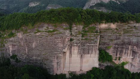 Dramatic-mountain-cliff,-Bajiao-Shan-mountain-precipice-in-China,-4K-aerial
