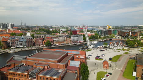 Aerial-view-showing-beautiful-port-and-pier-of-Gdansk-with-old-town-and-historic-buildings-during-sunny-day-in-Poland