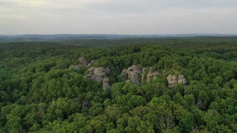 Vast-forestry-landscape-and-rocky-cliffs-in-aerial-drone-view