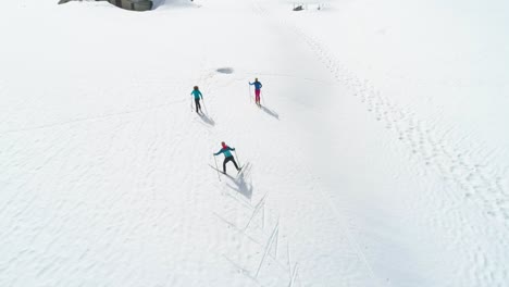 Group-of-friends-during-cross-country-ski-holiday-in-Jura-mountains-of-France---Valley-Combe-a-la-Chèvre
