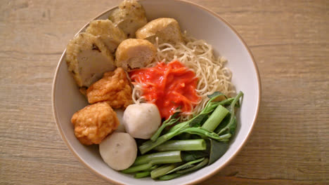 egg-noodles-with-fish-balls-and-shrimp-balls-in-pink-sauce,-Yen-Ta-Four-or-Yen-Ta-Fo---Asian-food-style