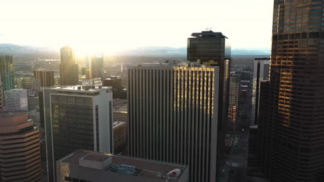Sunset-Above-Downtown-Denver-Colorado-USA,-Drone-Aerial-View,-Central-Buildings-and-Sunlight-Backlight
