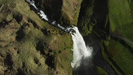 Seljalandsfoss-waterfall-on-edge-of-Highlands-in-Iceland,-aerial