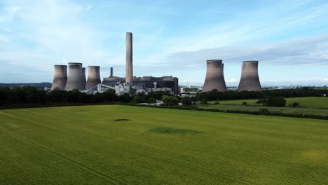 Fiddlers-ferry-power-station-aerial-view-cooling-towers-across-agricultural-farmland-crops-lifting-up