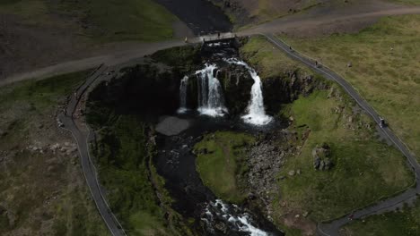 Kirkjufellsfoss-waterfall-in-mossy-landscape-of-Iceland-near-Kirkjufell-mountain