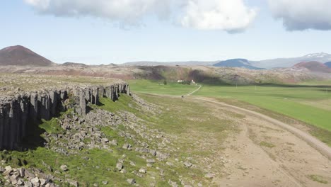 Gerouberg-basalt-columns-during-sunny-day-in-Iceland-Landscape,-aerial