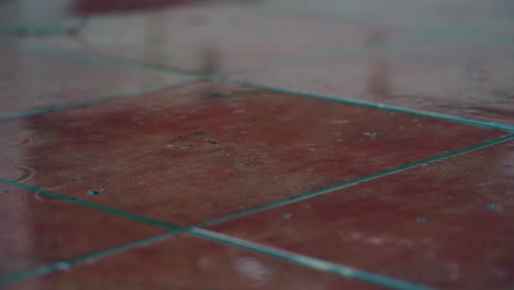 Rain-falling-on-floor-tiles