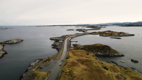 Cars-Driving-On-The-Road-Passing-By-Island-In-Atlantic-Ocean-In-Norway