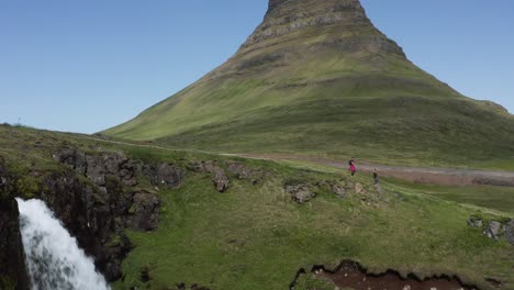 Kirkjufellsfoss-waterfall-in-scenic-landscape-of-Iceland-with-Kirkjufell-mountain