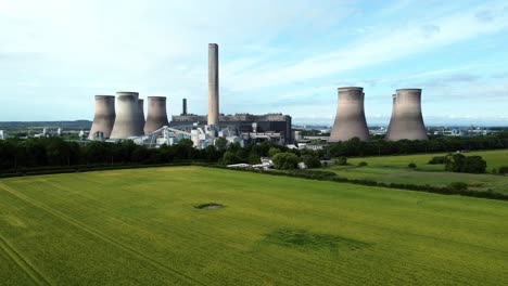 Fiddlers-ferry-power-station-aerial-view-cooling-towers-across-agricultural-farmland-crops-slowly-lowering-to-field