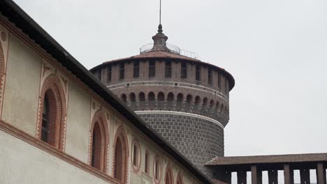 Focus-on-Sforzesco-castle-tower,-with-elements-of-cloister