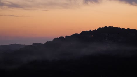 Beautiful-soft-orange-sunset-behind-hills-in-Chia,-Southern-Sardinia,-Italy