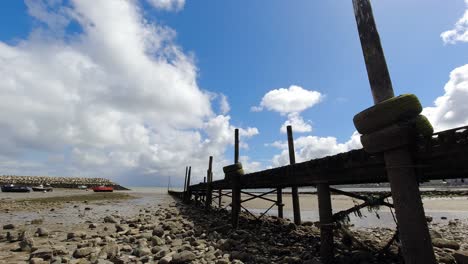 Blue-sky-harbour-platform-low-tide-time-lapse-fast-cloudy-Conwy-North-Wales-weather