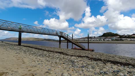 Floating-dock-harbour-elevated-walkway-platform-on-Llandudno-beach-relaxing-moody-sky
