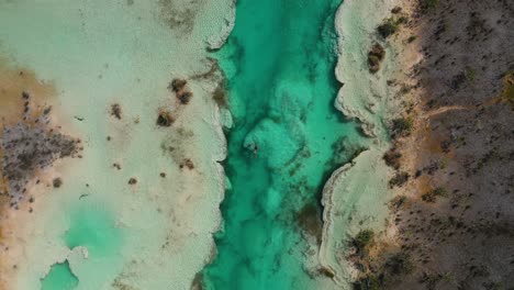 People-swimming-in-tropical-Mexico-river,-Rapids-of-Bacalar,-aerial-view