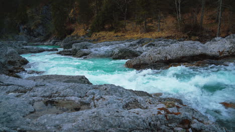 Seamless-video-loop-Cinemagraph-of-an-idyllic-mountain-river-waterfall-canyon-with-fresh-blue-water-in-the-scenic-Bavarian-Austrian-alps,-flowing-down-a-beautiful-forest-along-trees-and-rocks
