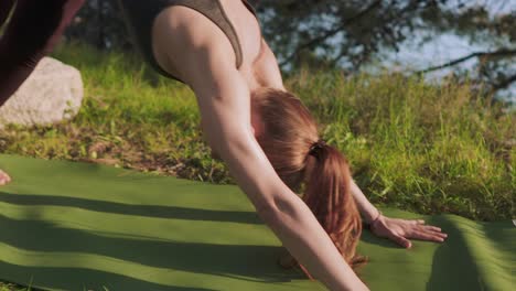 Young-lady-performing-yoga-outside,-sunrise-asana-flow-in-forest
