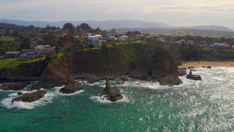 Scenic-View-Of-Cathedral-Rocks-Near-Coastal-Town-In-Kiama-Downs,-New-South-Wales,-Australia---aerial-shot