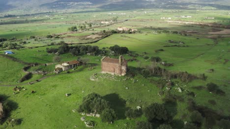 Old-Church-In-The-Middle-Of-Green-Field---aerial-drone-shot